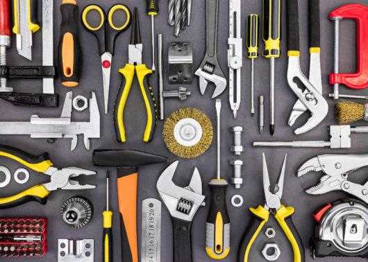 Variety of tools including wrench, screwdriver, hammer, pliers and tape measure